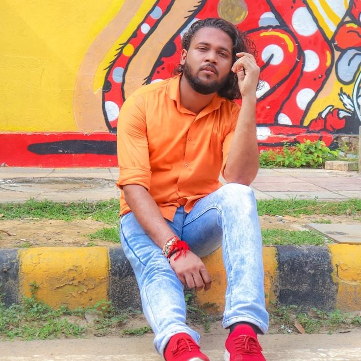 Asha Malik, Lead Design Curator at Modern Node Press, reviewing corporate floral arrangements